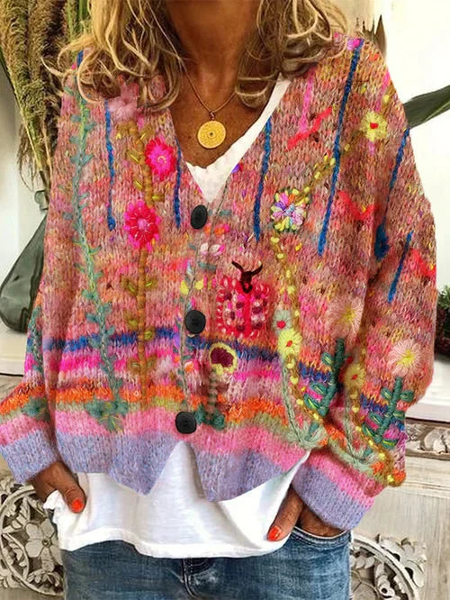 Orange-toned patterned cardigan with dark front buttons.