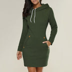 Green Hagia dress with a folded hood edge and small tan pocket accents.