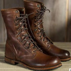 Dark brown lace-up boots with rounded toes and low heels.