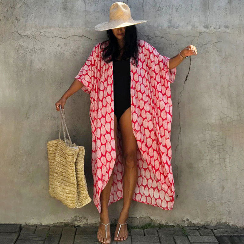 Red leaf-print cover-up with a long loose body.