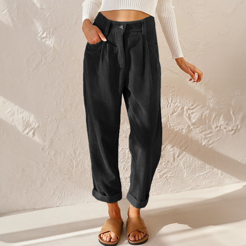Black corduroy trousers with front pockets and rolled hems.