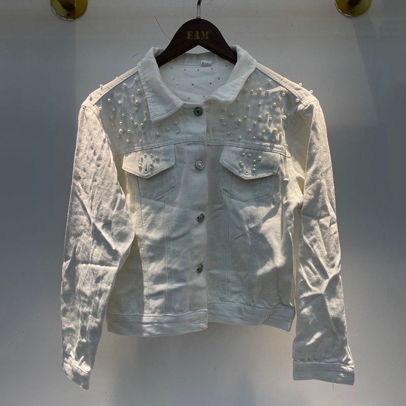 White beaded denim jacket shown hanging from the front.