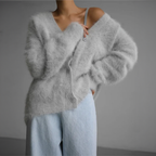 Light grey fluffy cardigan with a V neckline, shown from the front.