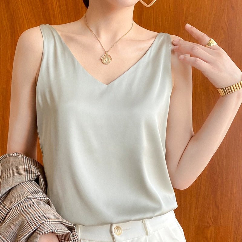 Pale green sleeveless Trigala top with a V neckline.