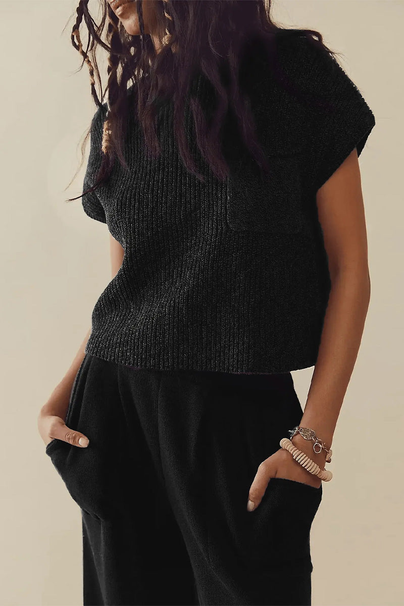 Black short-sleeve knit top and black trousers shown from the front.
