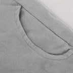 Close-up of the grey pocket opening and fabric.