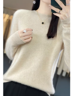 Cream jumper with a rounded neckline and long sleeves.