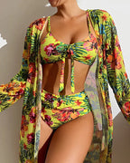 Bright green floral bikini worn with a matching long-sleeve cover-up.
