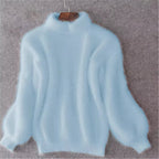 Light blue fuzzy knit jumper with a high neck, full sleeves and ribbed cuffs.