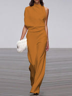 Yellow jumpsuit with a draped neckline shown on a model.