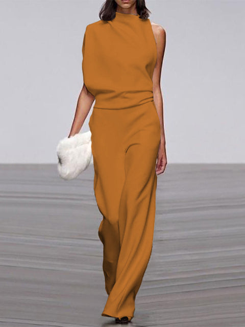 Yellow jumpsuit with a draped neckline shown on a model.