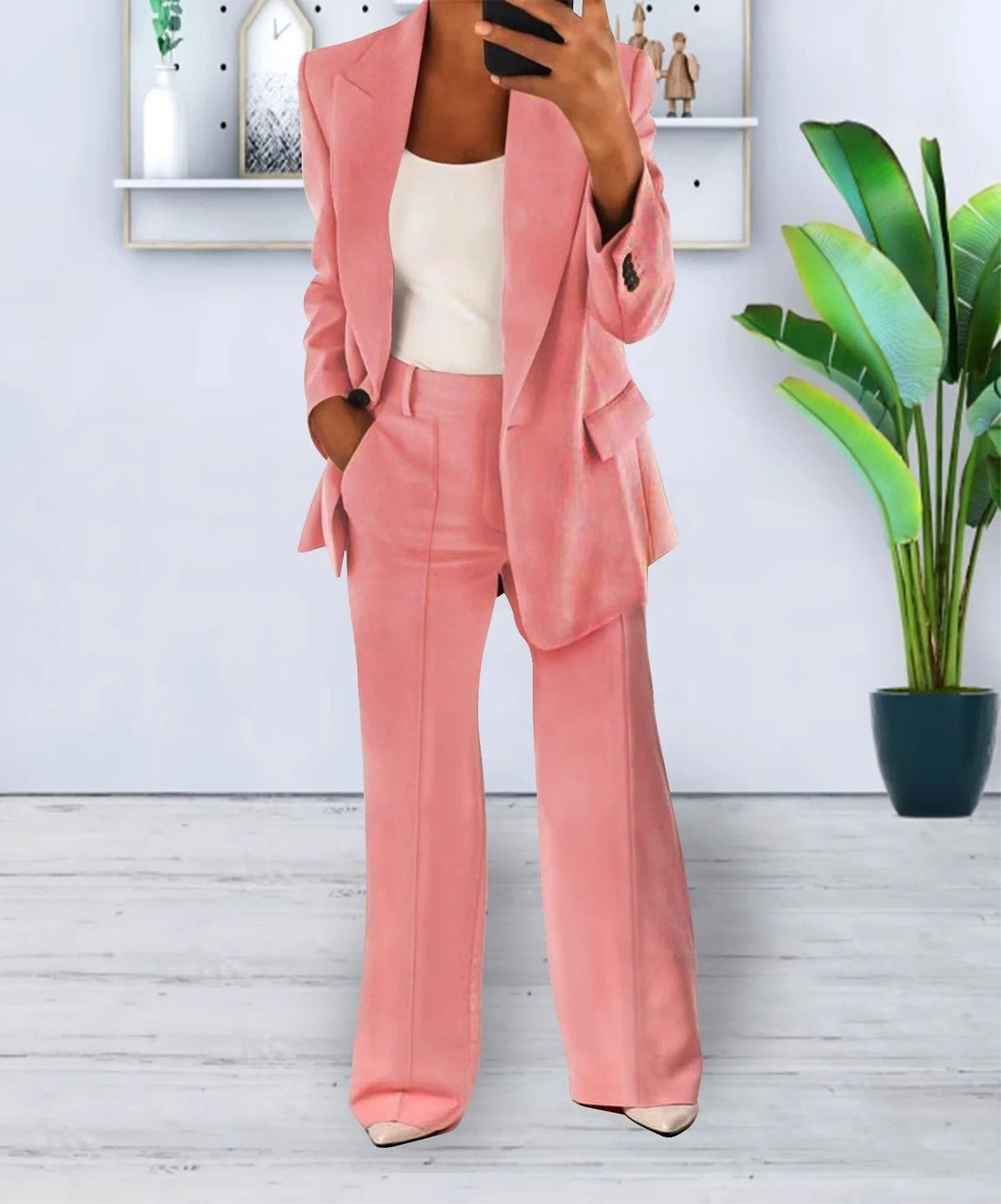 Pink lapel jacket and matching full-length trousers.