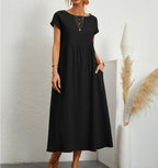 Black Ginovu dress with short sleeves, a gathered waist and side pockets.
