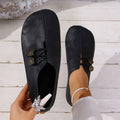 Top view of black slip-on shoes showing their rounded toe shape.