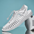 White cord sandal with a toggle lace and open slingback heel.