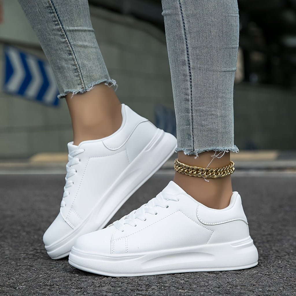 All-white trainers shown together from side and front angles.