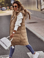 Side view of the beige gilet with a handbag alongside.