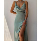 Front view of a green occasion dress with draped bodice and leg slit.