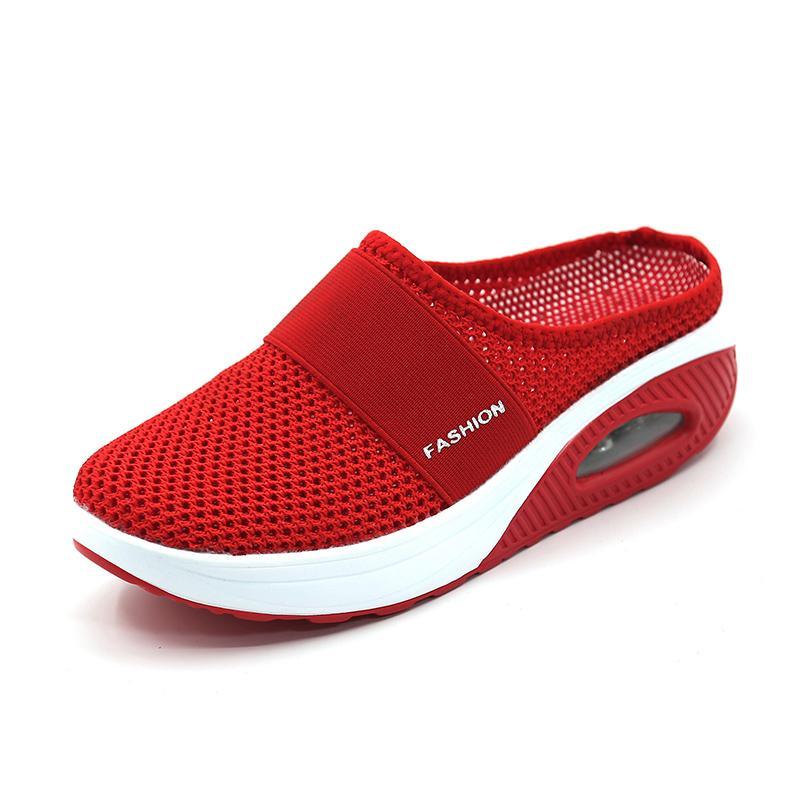Red mesh mule with a white-edged sole and a wide front band.