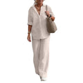 Pale cream shirt and matching loose trousers, shown against white.