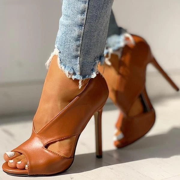 Brown peep-toe stiletto heels shown from the front at an angle.