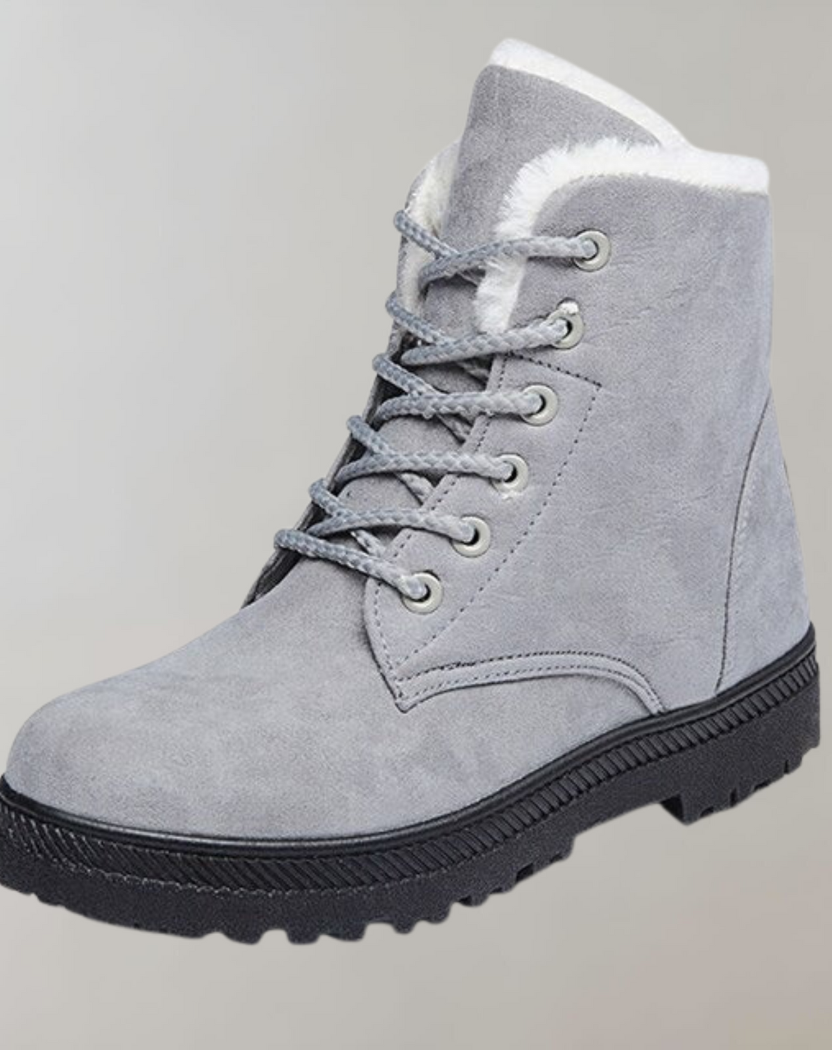 Grey lace-up ankle boot showing its side seam and fluffy lining.