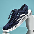 Dark blue cord sandal with a white sole and open slingback heel.