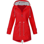 Red hooded coat with waist cords and a longer curved hem.