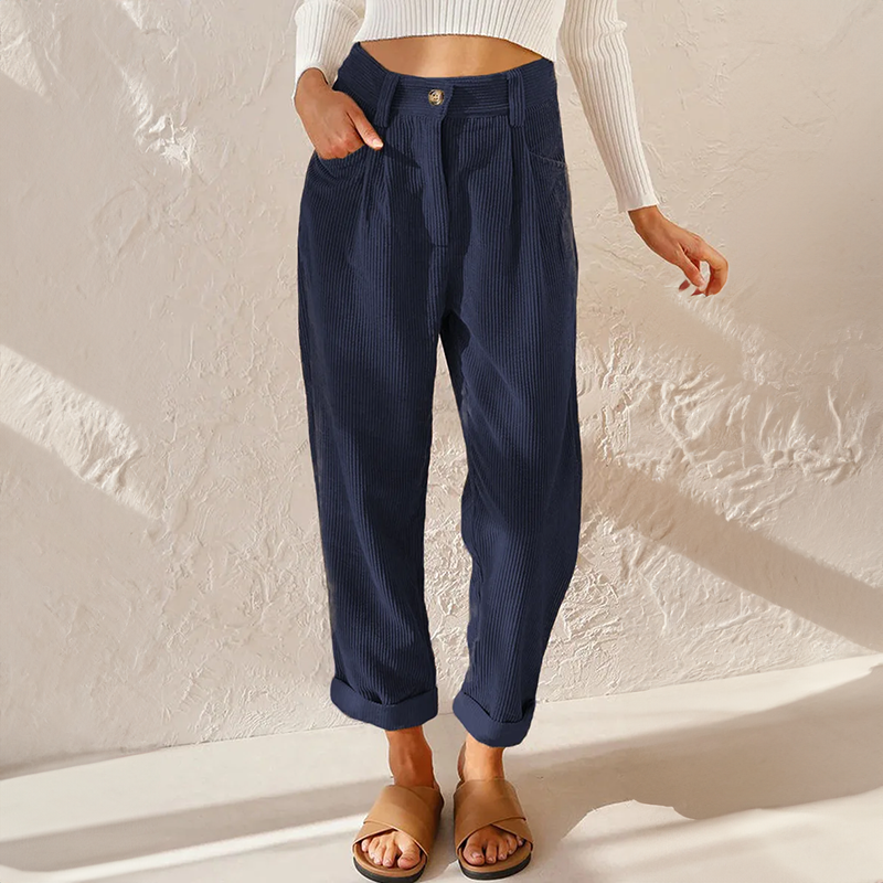 Dark blue corduroy trousers styled with sandals.