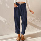 Dark blue corduroy trousers styled with sandals.