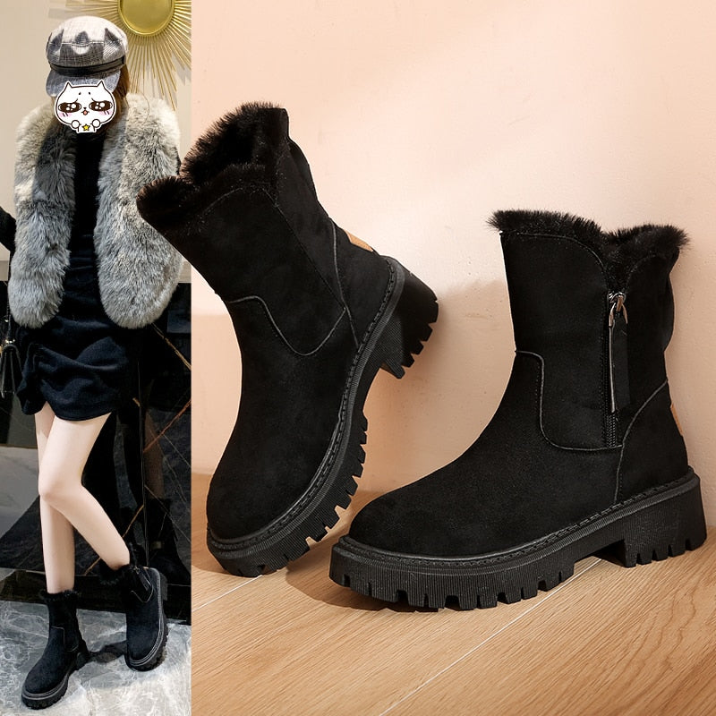 Black ankle boots with fluffy trim and deep-cut tread edges.
