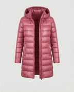 Pink long quilted jacket with a hood.