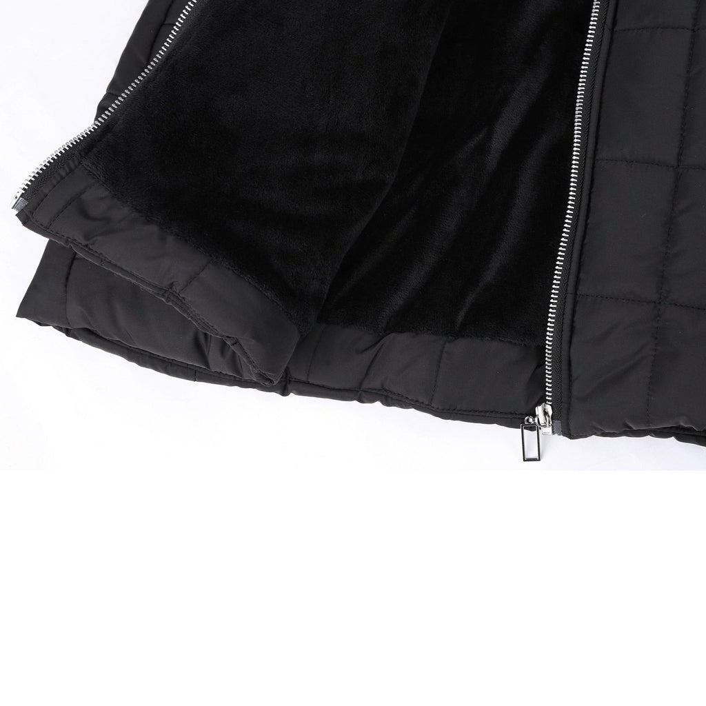 Black coat lining and front zip shown close up.