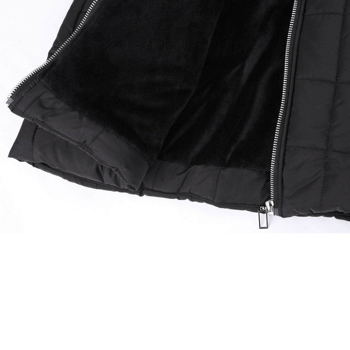 Black coat lining and front zip shown close up.