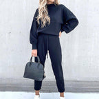 Navy blue lounge set with balloon sleeves and high-waist trousers.