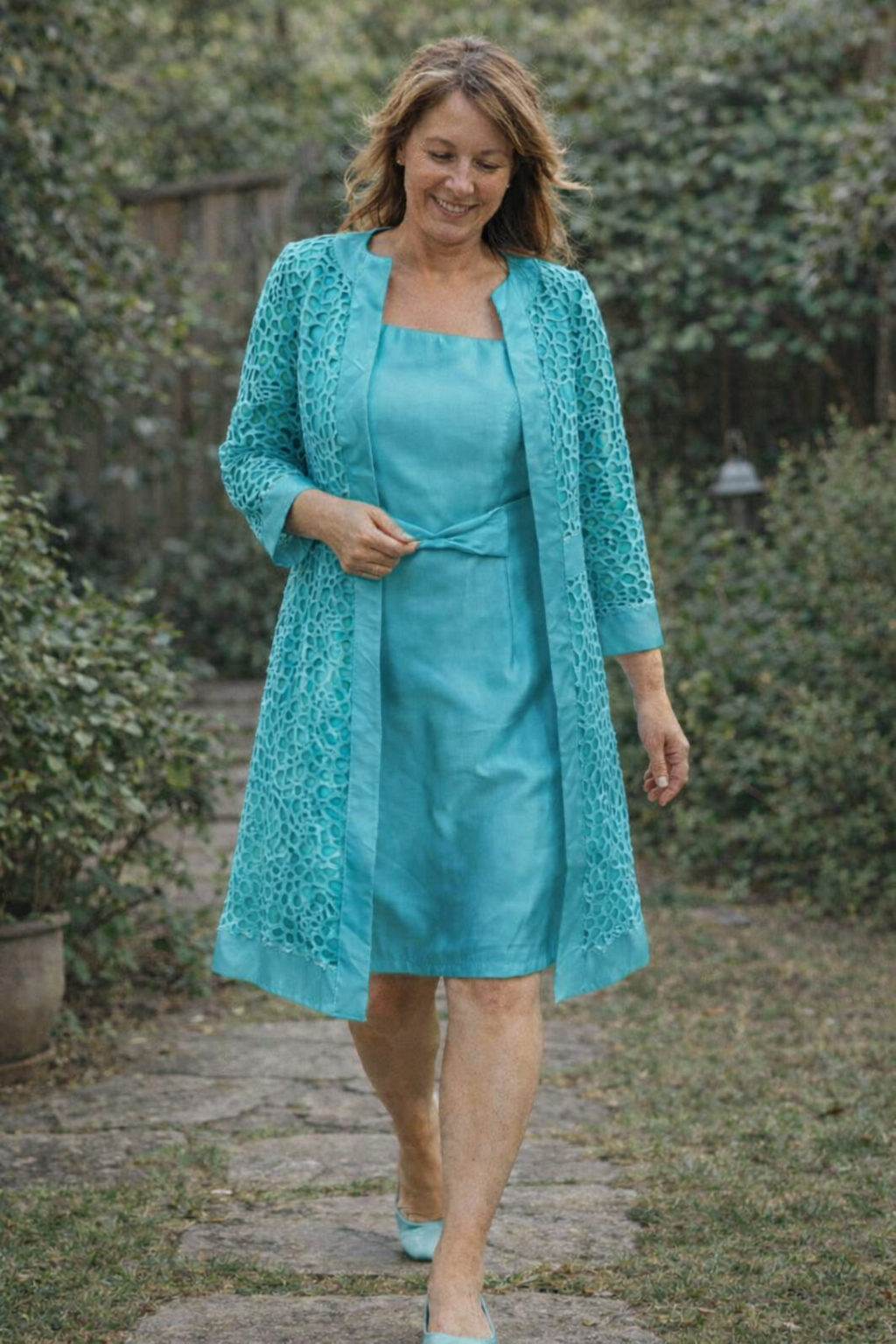 Peacock blue dress and matching patterned jacket.