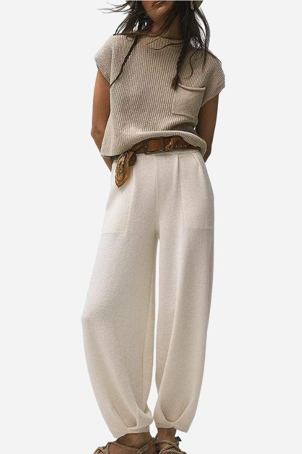 Beige top with cream high-waist trousers and a brown styling belt.