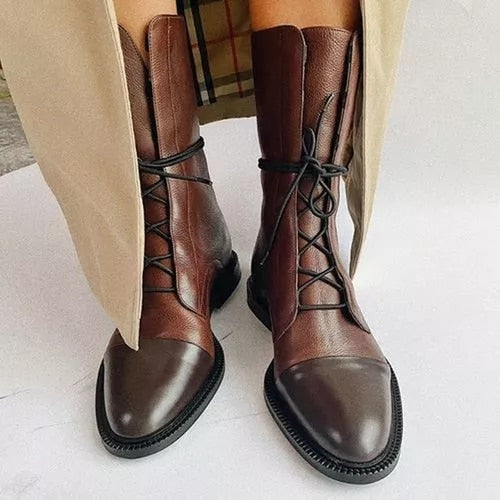 Brown lace-up boots with darker toe caps and low heels.