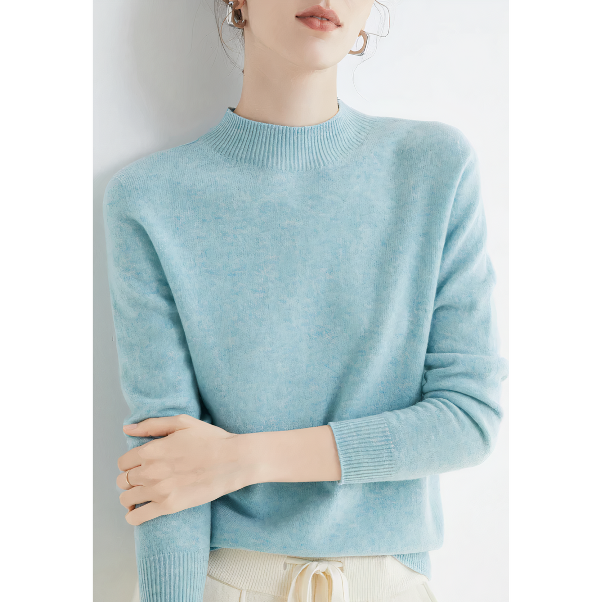 Sky-blue jumper showing its narrow ribbed collar and cuffs.