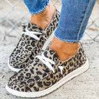Leopard-print lace-up shoes with pale soles.