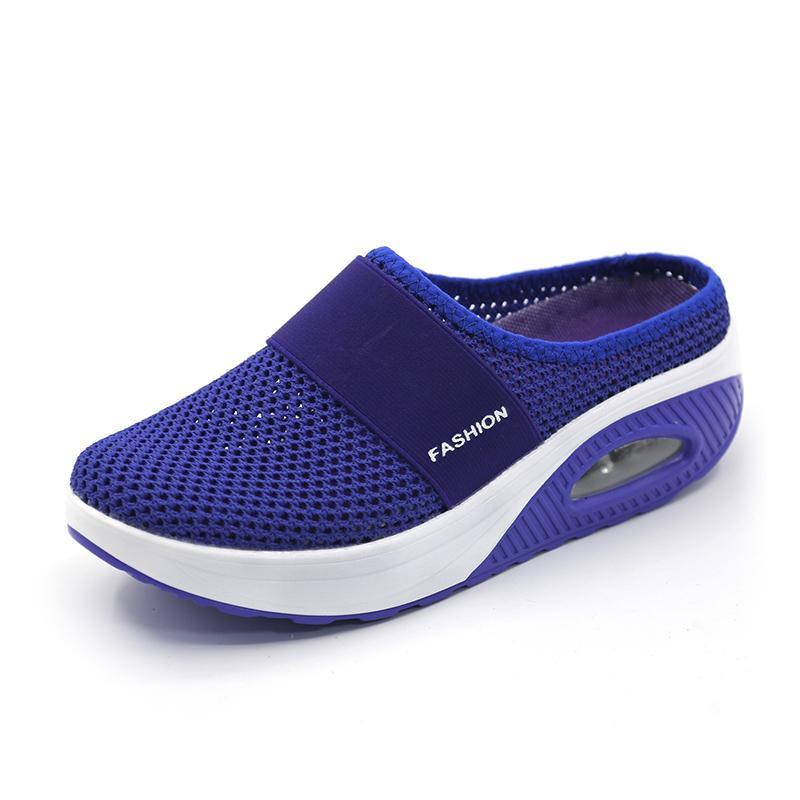 Deep blue mesh mule with a matching heel and white sole section.