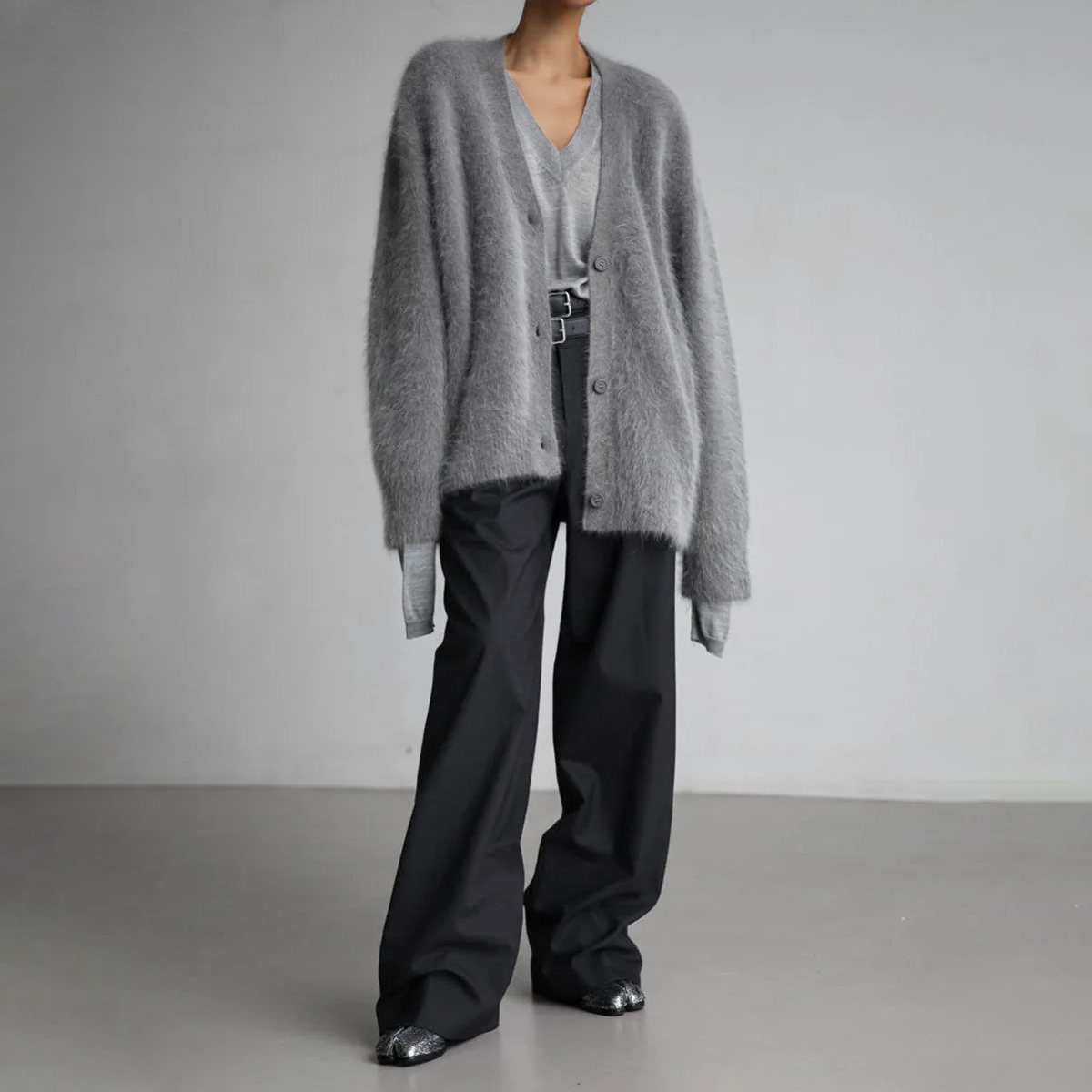 Grey button-front cardigan with dropped shoulders and long sleeves.
