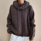 Brown jumper shown from the front with ribbed edges.