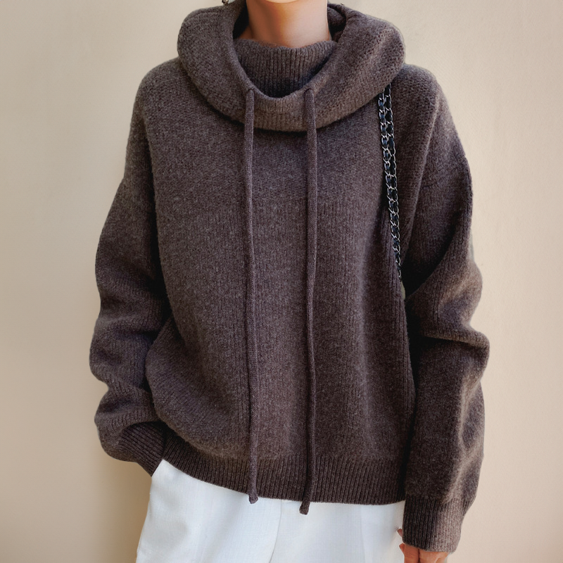 Brown jumper shown from the front with ribbed edges.
