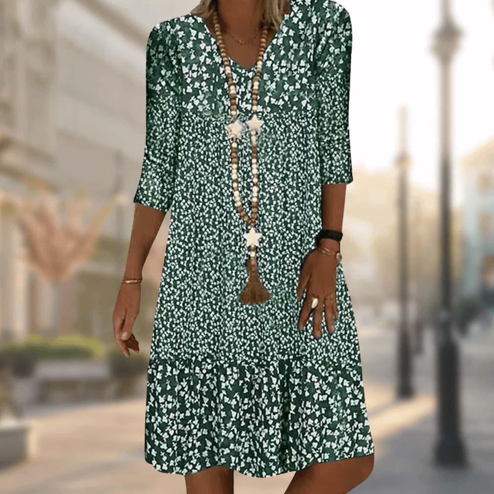 Green floral V-neck dress with a gathered lower tier.