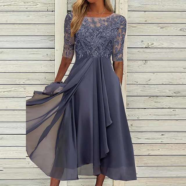 Muted purple party dress with lace sleeves and an overlapping sheer-looking skirt.