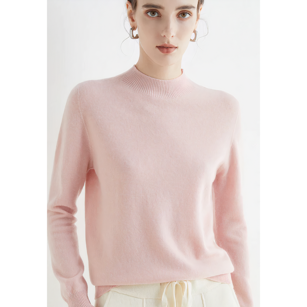 Pale pink jumper with a plain body and long sleeves.