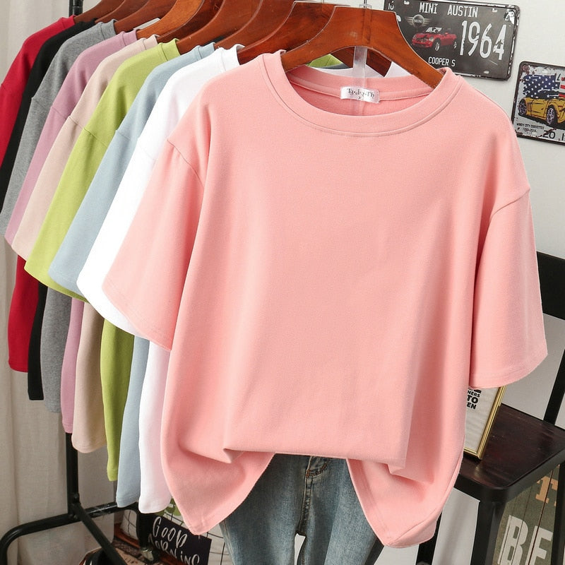 Pink T-shirt with dropped shoulder seams and a ribbed neckline.