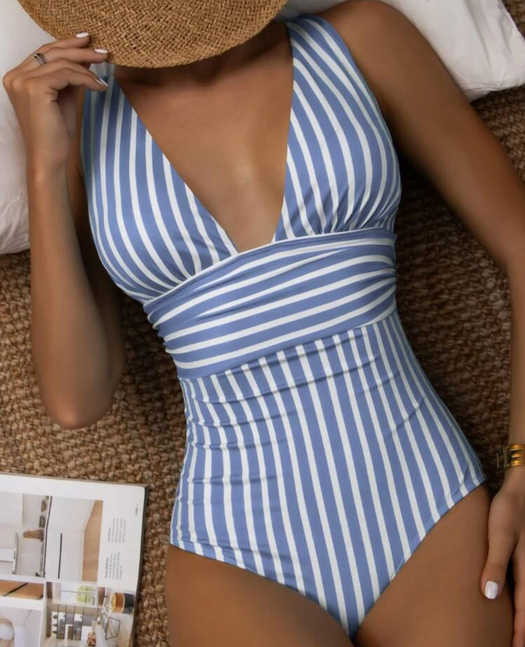 Blue-grey and white striped one-piece swimsuit.