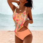 Orange patterned tankini top paired with peach briefs.